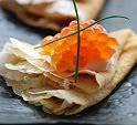 Blini with sour cream and red caviar.jpg